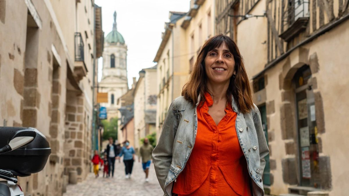 A young tourist at the medieval half-timbered houses in Rennes. Capital of Brittany, France