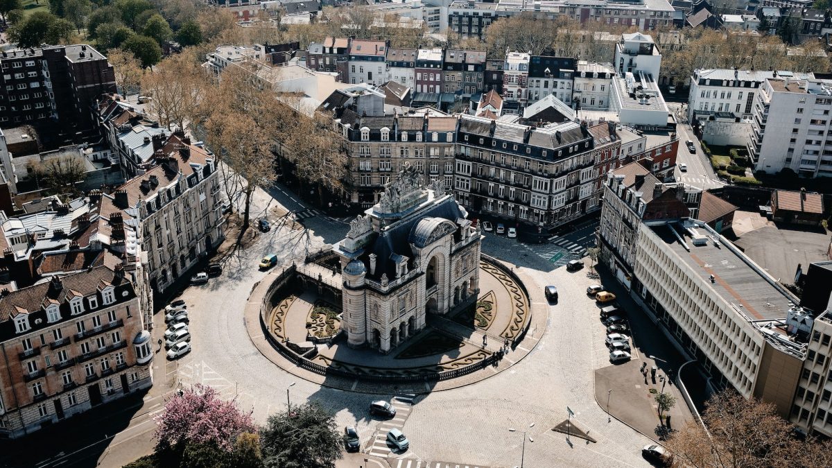 Aerial shot of a cityscape with a lot of cars and beautiful buildings in Lille, France
