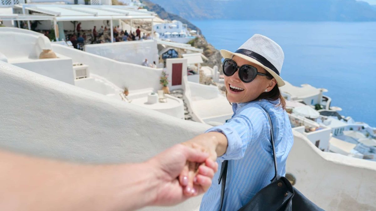 Mature couple traveling together, male hand holding female