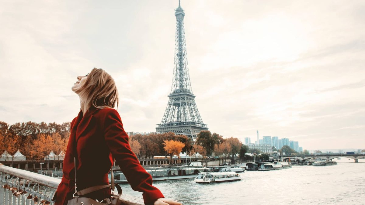 Style girl in Paris with Eiffel tower on background